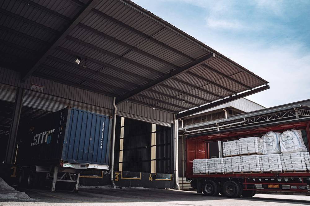 Bagged cargo loaded on a truck at a warehouse loading bay