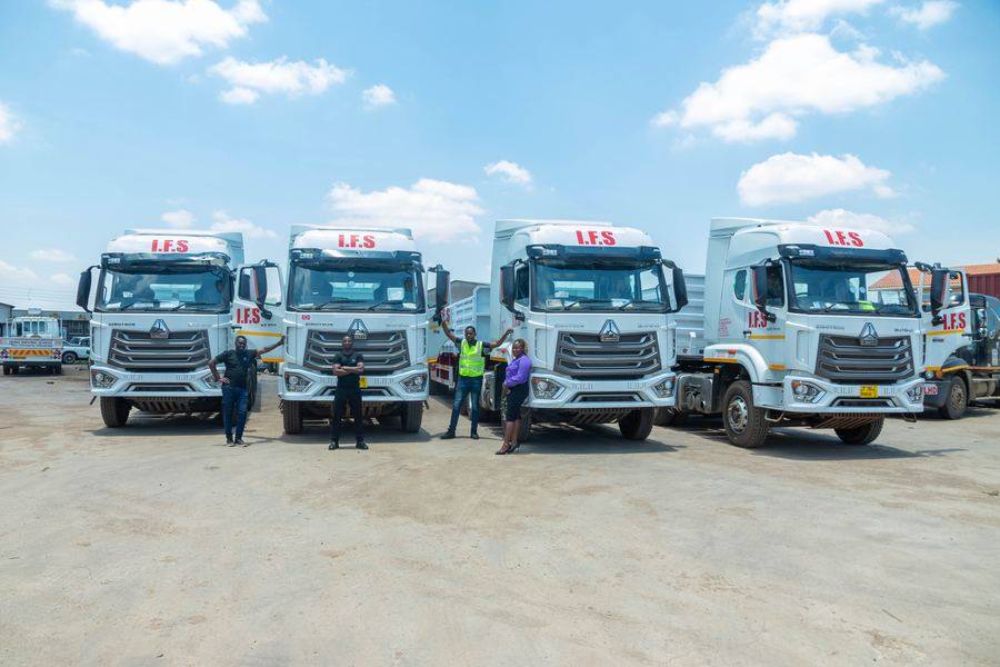 Nomela Logistics fleet with staff